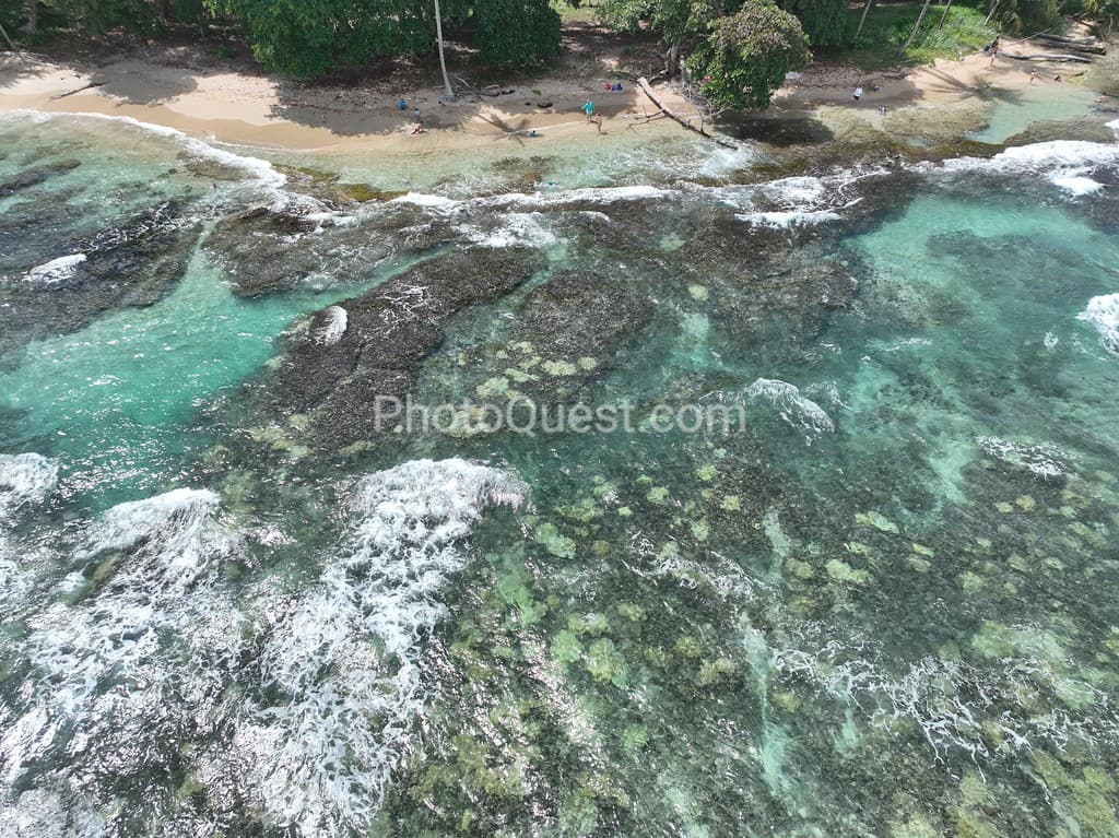 Playa Cocles and Limon coastline: Clear water, sandy beach.