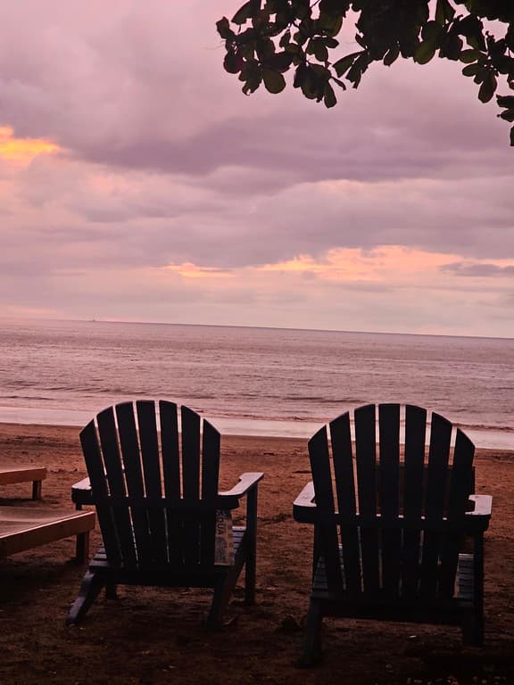 Beach chairs, sunset, relaxing ocean view vacation