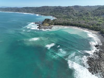 Santa Teresa, Costa Rica: Turquoise Waves Crashing on Rocky Shore