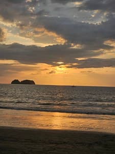 Golden Hour at Sea: Serene Beach Sunset