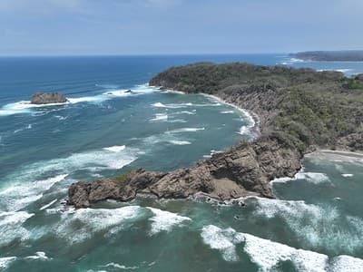 Samara, Costa Rica coast: waves breaking on rocks