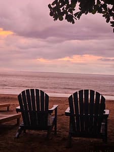 Beach chairs, sunset, relaxing ocean view vacation